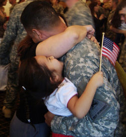 Soldier and family july 29 soldier hugging family 2 True Sacrifice 4th of July